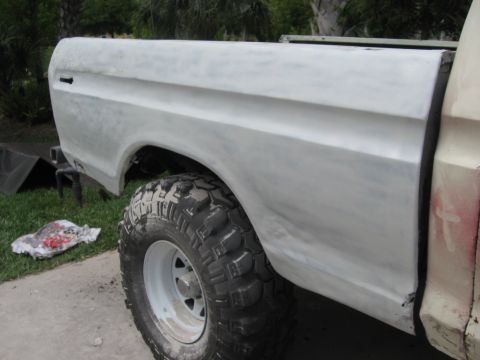 1979 Ford F-150 - This 1979 Ford F-150 is undergoing bodywork, showing the primed rear fender and bed section.