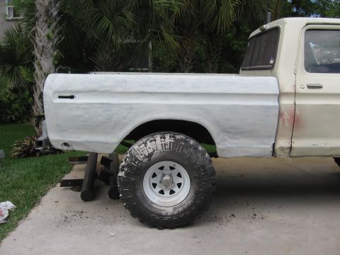 1979 Ford F-150 - The rear quarter panel and bed of a pickup truck are shown, appearing to be undergoing bodywork.