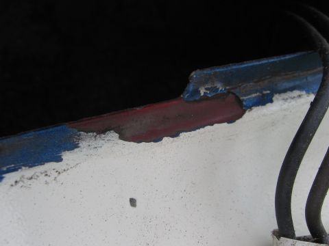 1979 Ford F-150 - The paint is peeling on the edge of the vehicle, revealing layers of color and rust beneath.