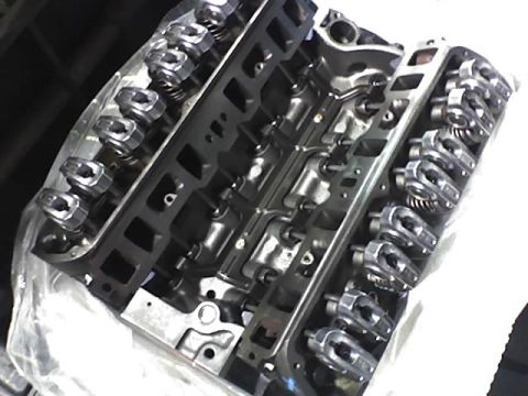 1991 Ford Mustang - Close-up view of an engine block, showing internal components like rocker arms and valve springs.