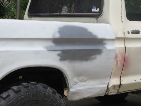 1979 Ford F-150 - This truck's body panel is being prepped for paint, with visible body filler and primer applied.