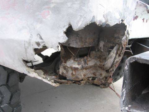 1979 Ford F-150 - This image shows significant rust and damage to a vehicle's body panel, indicating severe deterioration.