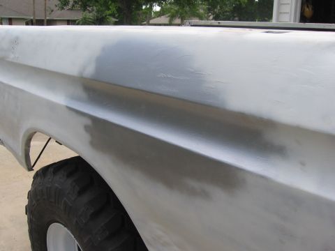 1979 Ford F-150 - Side view of a 1979 Ford F-150 truck bed panel being prepped for paint.