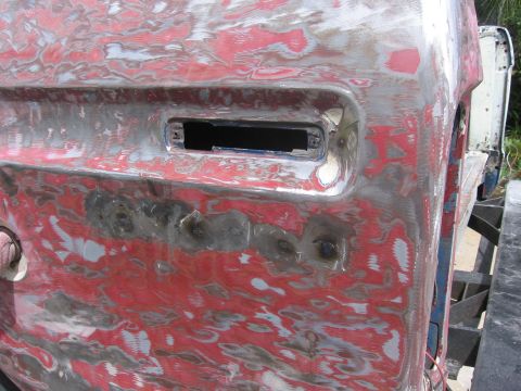 1979 Ford F-150 - This 1979 Ford F-150 door is undergoing bodywork, showing primer and filler.