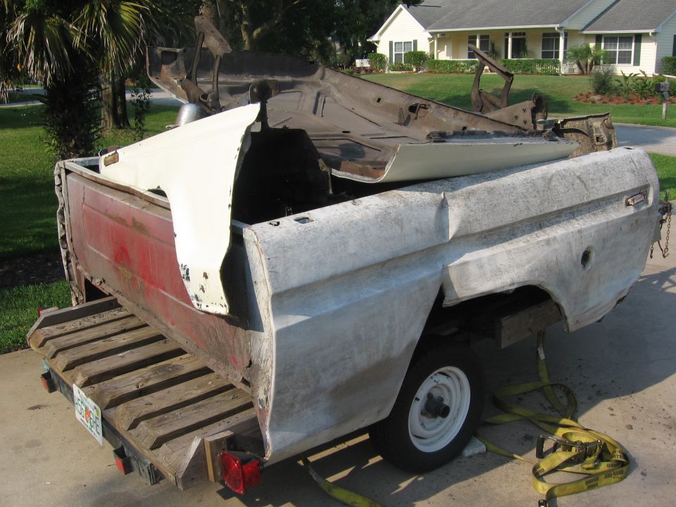 1979 Ford F-150 disassembled truck bed and cab on trailer