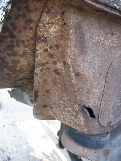 1979 Ford F-150 - Close-up of corroded vehicle undercarriage, revealing significant rust damage.