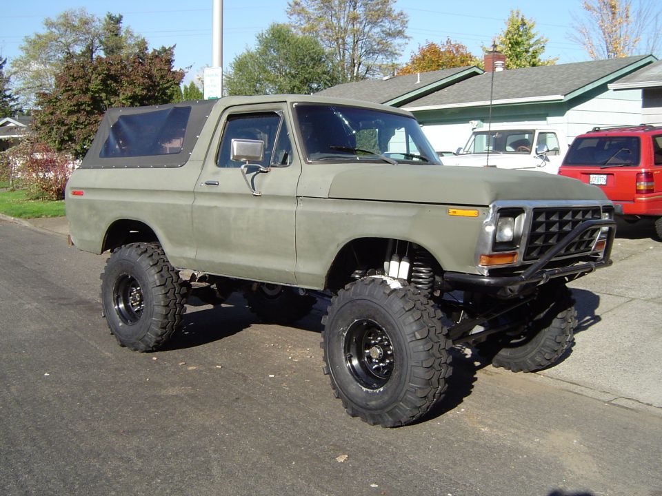1978 Ford Bronco, lifted, with large off-road tires and aftermarket bumper