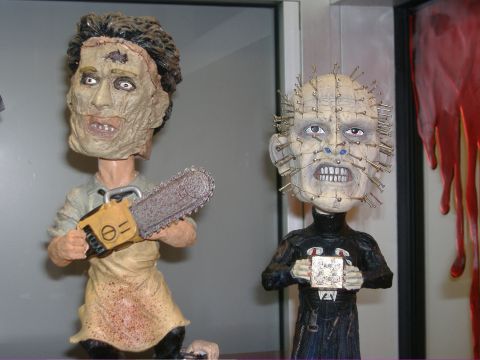 1991 Ford Bronco - Figures of Leatherface and Pinhead are displayed, with a bloody background element visible.