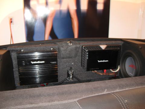 2002 Pontiac Trans Am - Custom car audio setup two Rockford Fosgate amplifiers and a subwoofer, likely in the trunk.