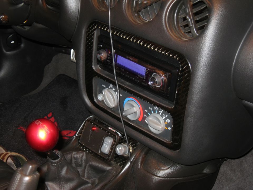 2002 Pontiac Trans Am interior with aftermarket stereo and carbon fiber trim