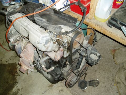 2000 Ford E350 - Engine assembly with visible turbocharger and intake manifold components.