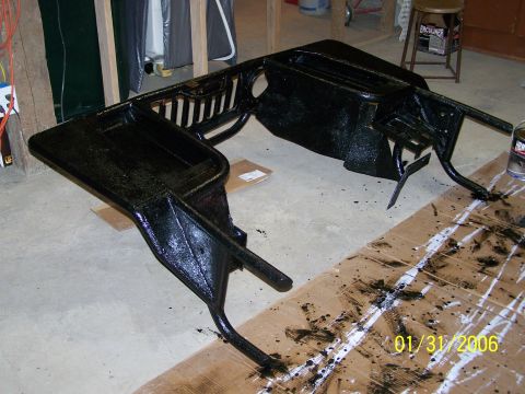 1988 Suzuki Samurai - Dashboard frame being painted, likely for a restoration project.