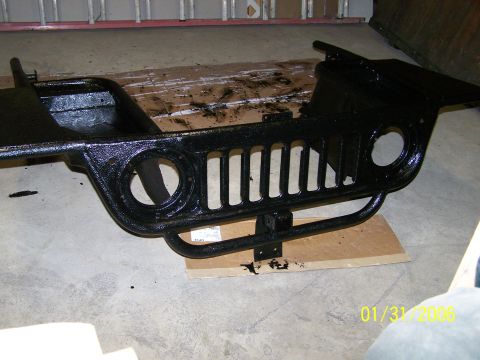 1988 Suzuki Samurai - This is a front end assembly for a Jeep Wrangler, likely being prepped for installation or repair.