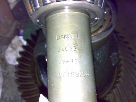 1995 Ford F-150 - Close-up of a differential gear assembly, showing stamped part numbers and a bearing.