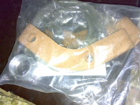 1995 Ford F-150 - This image shows a new brake shoe kit packaged in plastic, with visible components for a vehicle's braking system.