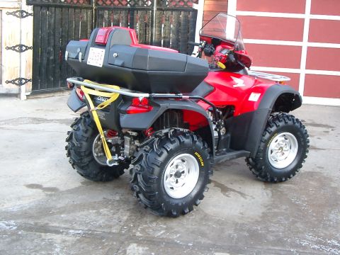 2004 Honda RINCON - Rear view of a red 2004 Honda Rincon ATV equipped with a large black storage box.