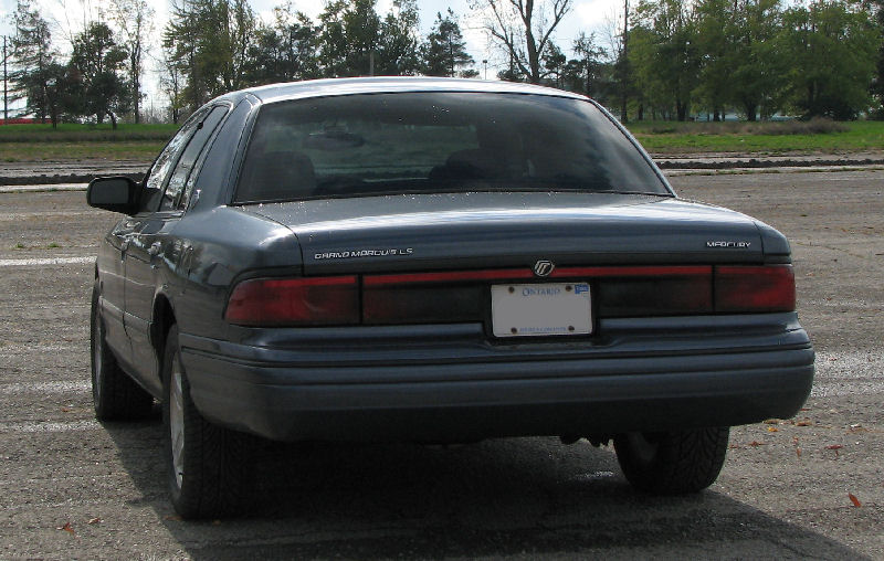 Dark green Mercury Grand Marquis LS sedan from the rear with Ontario plate