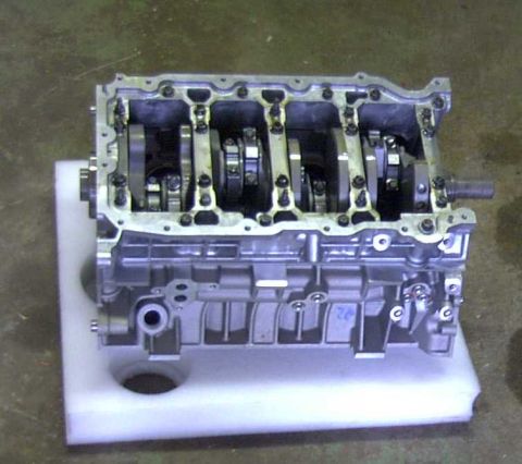 1997 Ford Taurus - Engine block assembly with internal components exposed, sitting on a protective foam base.