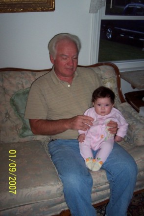 2000 Ford Crown Victoria - Man and baby on a couch, with a date stamp of January 9, 2007.