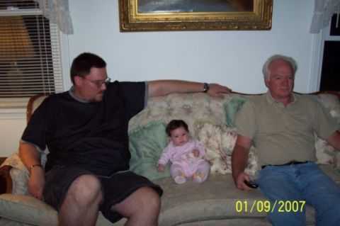 2000 Ford Crown Victoria - A family gathers on a couch, captured on January 9, 2007.