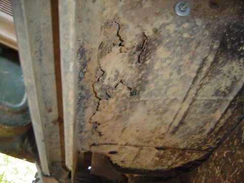 1986 Ford Bronco - The frame of the vehicle shows extensive rust and deterioration, indicating a need for repair or replacement.