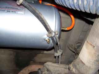 1990 Ford Bronco - 5 gal tank mounted just behind the rear crossmember.