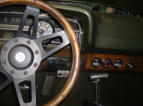 1970 Ford Ranchero - The interior of a 1970 Ford Ranchero shows an aftermarket steering wheel and dashboard gauges.