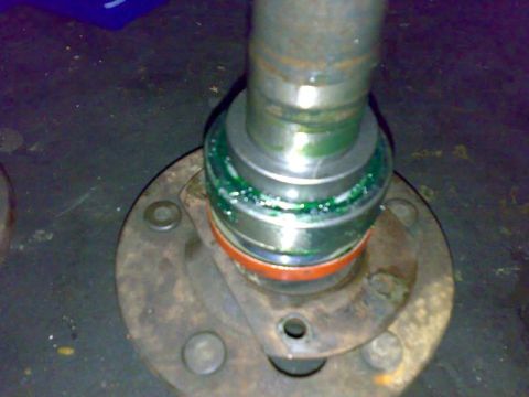 1995 Ford F-150 - Close-up view of a greased wheel bearing assembly, likely for a vehicle axle.
