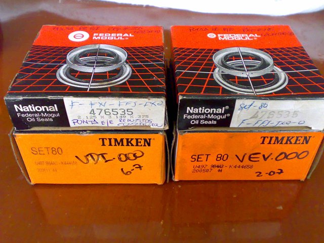 Two boxes of National Federal-Mogul oil seals and two boxes of Timken bearings, with part numbers and handwritten labels