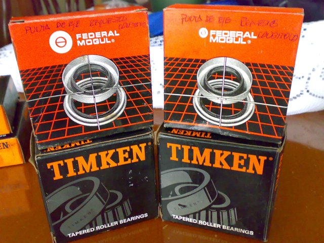 Two boxes of Federal Mogul bearings stacked on top of two boxes of Timken tapered roller bearings
