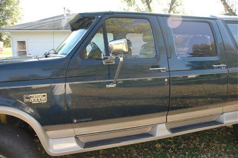 1995 Ford C-350 (Centurion Conversions) - Side view of a 1995 Ford C-350 (Centurion Conversions) truck, highlighting its classic styling and dual-tone paint.