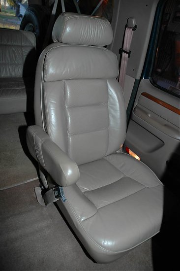 1995 Ford C-350 (Centurion Conversions) - Interior view of a tan leather captain's chair, likely from a van or RV conversion.