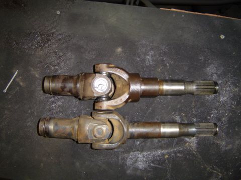 1989 Ford Bronco - Two driveshafts are shown side-by-side, each with a universal joint and splined end.
