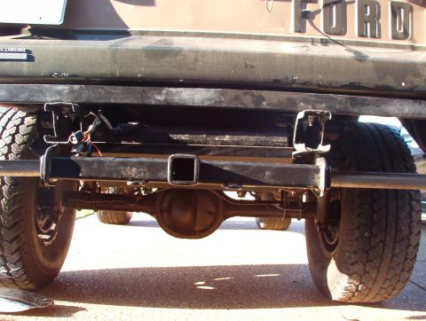 1975 Ford Bronco - Close-up view of a vehicle's rear bumper and hitch receiver assembly.