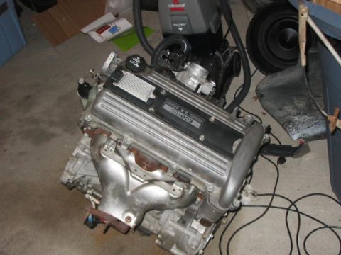 1900 Ford Wagon - An ECOTEC 2.2 engine is shown, likely in a garage or workshop setting.