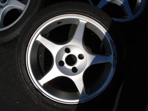 1979 Ford Bronco - Silver 5-spoke alloy wheels and tires are shown in this close-up view.