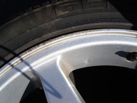 1979 Ford Bronco - A close-up shot focuses on the tire sidewall and alloy wheel, revealing some text and markings.