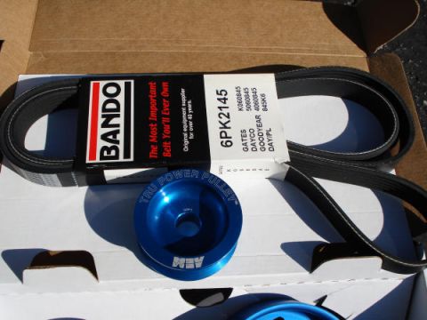 1979 Ford Bronco - A Bando serpentine belt and a blue AEM "Tru Power Pulley" are shown in their packaging.