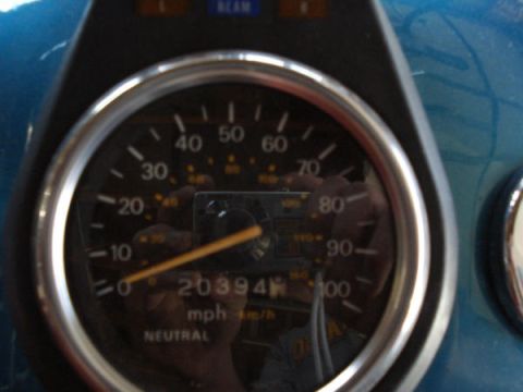 1979 Ford Bronco - Close-up of a vehicle's speedometer gauge, indicating 20,394 miles and the 'NEUTRAL' gear selection.