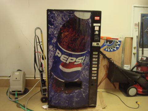 1979 Ford Bronco - A Pepsi vending machine is shown in a garage setting with other items.