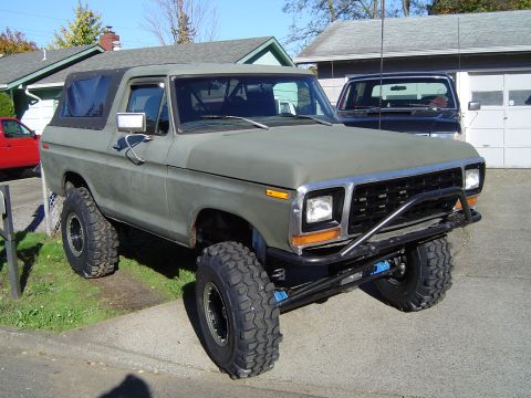 1978 Ford Bronco - This lifted 1978 Ford Bronco features aggressive off-road tires and a custom brush guard, ready for adventure.