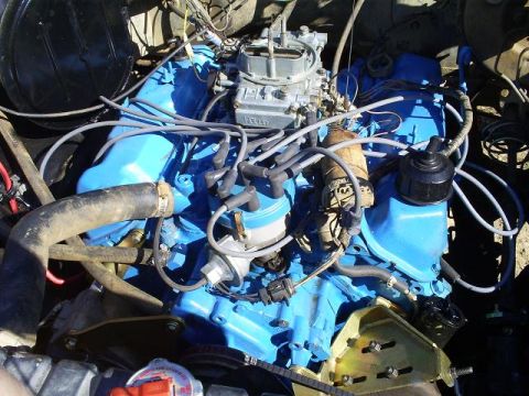 1979 Ford Bronco - Close-up view of a vehicle's engine bay, showing various components and wiring.