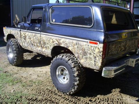 1979 Ford Bronco - This 1979 Ford Bronco features a distinctive camouflage body wrap and lifted suspension.