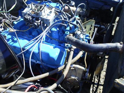 1979 Ford Bronco - Close-up view of a vehicle's engine compartment, showing various components and wiring.