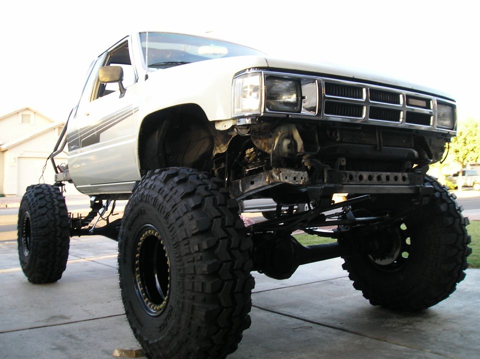 1986 Toyota Hilux with lifted suspension and large off-road tires