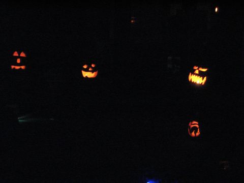 1991 Ford Bronco - A collection of jack-o'-lanterns are displayed in the darkness.