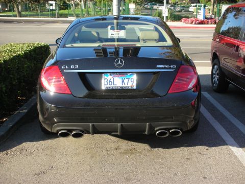 1998 Ford Crown Victoria - Rear view of a black Mercedes-Benz CL 63 AMG coupe with quad tailpipes and a California license plate reading 36L K79.