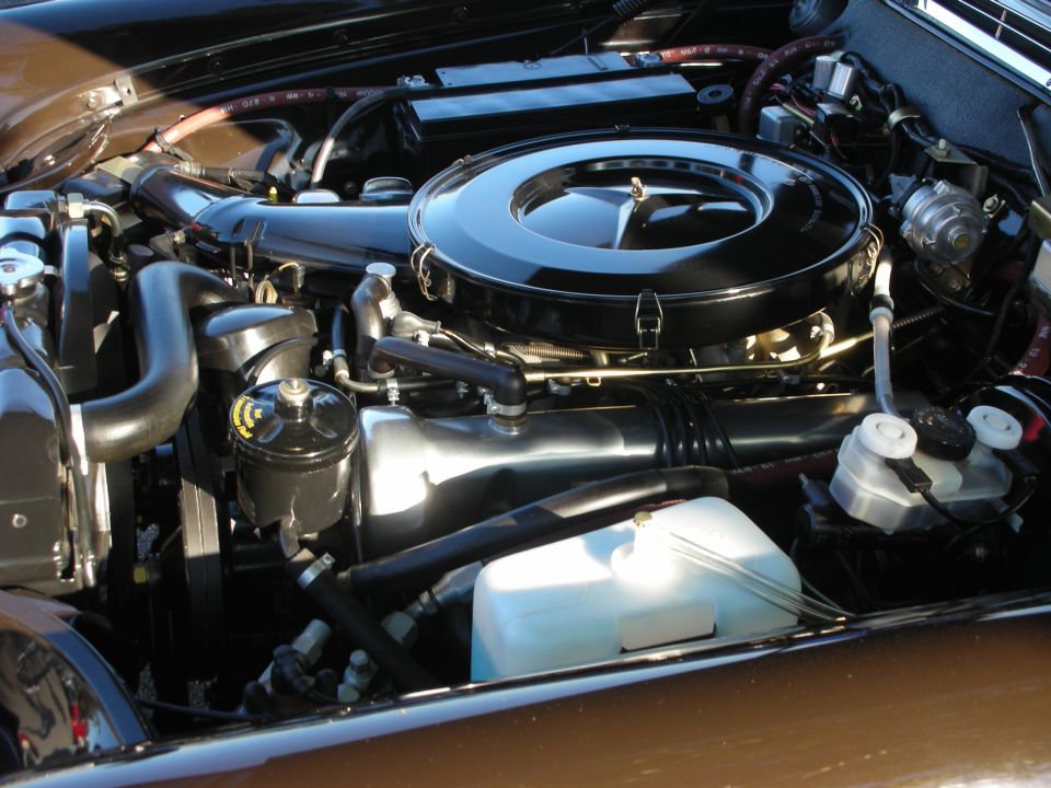 Mercedes V8 engine bay with chrome air cleaner and star-logo lid
