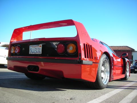 1998 Ford Crown Victoria - Rear view of a red Ferrari F40 highlighting its full-width wing, round tail lights and a 5LLF131 California license plate.