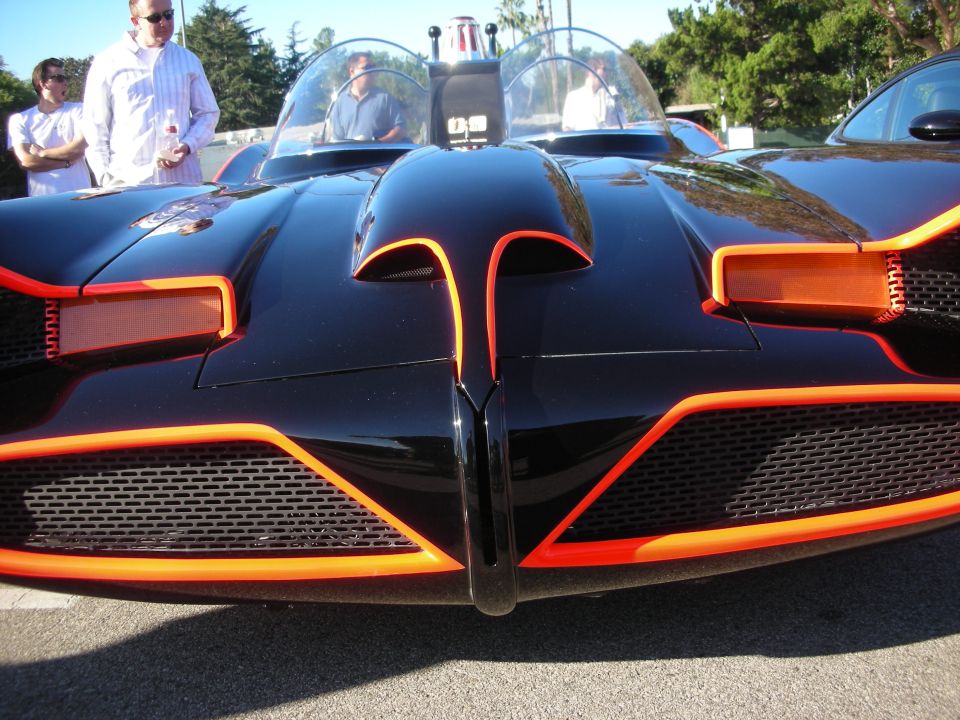 Close front view of black Batmobile replica nose with red trim and grilles